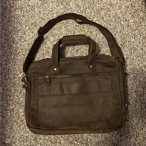 Leather messenger bag/satchel. No brand apparent. Never used!